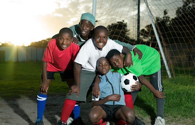 Group of teenage boys with football