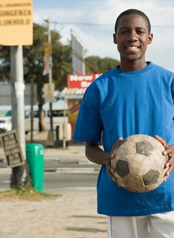 Teenage african boy with football